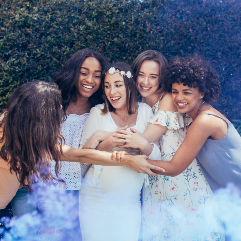 a group of women at a baby shower posing a picture